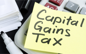 Financial documents representing capital gains tax rates on business sales