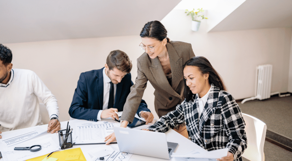Business owner reviewing financial documents and tax calculations related to selling a business in Canada