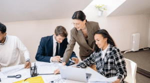 Business owner reviewing financial documents and tax calculations related to selling a business in Canada