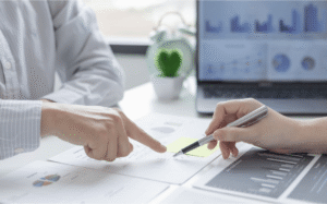 Calculator and financial charts showing tax calculation