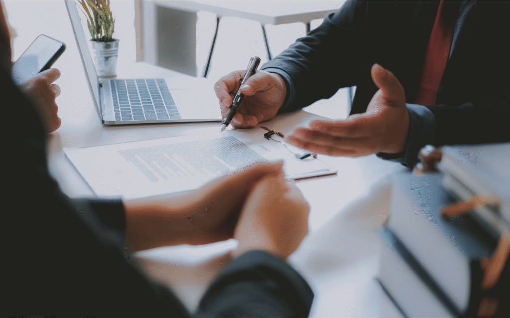 Business owner preparing company for sale with planning documents and a business valuation checklist